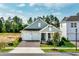 Charming single-Gathering home boasting a two-car garage, brick pathway, and a welcoming covered front porch at 16241 Honey Harvest St, Winter Garden, FL 34787
