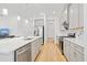 Contemporary kitchen featuring an island with seating, stainless steel appliances, and an open floor plan at 16241 Honey Harvest St, Winter Garden, FL 34787
