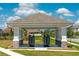 Community mail kiosk featuring a covered structure with stone accents and lush landscaping at 16241 Honey Harvest St, Winter Garden, FL 34787