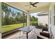 Relaxing screened patio with brick flooring, ceiling fan, and beautiful backyard views at 16241 Honey Harvest St, Winter Garden, FL 34787