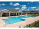Community pool featuring a spacious deck area with ample seating and clear blue water at 16241 Honey Harvest St, Winter Garden, FL 34787