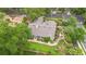 A beautiful aerial view of a landscaped home, boasting a lush garden, mature trees and brick-lined walkways at 1637 Bent Oaks Blvd, Deland, FL 32724