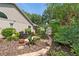 Backyard landscape with a brick patio, outdoor seating, and lush greenery, perfect for enjoying the outdoors at 1637 Bent Oaks Blvd, Deland, FL 32724