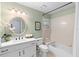 This bathroom has a vanity with storage, a sink, a toilet, and a shower/tub combo at 1637 Bent Oaks Blvd, Deland, FL 32724