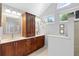 A bathroom with double sinks, storage cabinets and drawers, and windows for natural light at 1637 Bent Oaks Blvd, Deland, FL 32724