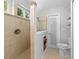 The bathroom has a tiled shower, a glass-enclosed shower, and a toilet at 1637 Bent Oaks Blvd, Deland, FL 32724