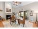 Cozy dining area with a fireplace, dining table and chairs, and natural light at 1637 Bent Oaks Blvd, Deland, FL 32724