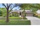 Traditional home with a manicured lawn and mature landscaping at 1637 Bent Oaks Blvd, Deland, FL 32724