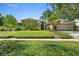Charming single-story home with a beautifully landscaped front yard and an attached two-car garage at 1637 Bent Oaks Blvd, Deland, FL 32724