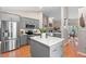 Bright eat-in kitchen boasts an island, stainless steel appliances, and modern cabinetry at 1637 Bent Oaks Blvd, Deland, FL 32724