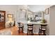 Charming kitchen boasts a breakfast bar, lovely gray cabinetry, and modern appliances at 1637 Bent Oaks Blvd, Deland, FL 32724