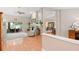 Open-concept living room featuring a fireplace, vaulted ceilings, and wood floors at 1637 Bent Oaks Blvd, Deland, FL 32724