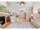 Bright living room featuring an airy design with a fireplace, plush seating, and natural light at 1637 Bent Oaks Blvd, Deland, FL 32724