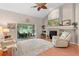 Cozy living room with a fireplace and sliding doors to the outdoor screened patio at 1637 Bent Oaks Blvd, Deland, FL 32724