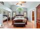 Spacious main bedroom featuring vaulted ceilings, large windows, and hardwood floors at 1637 Bent Oaks Blvd, Deland, FL 32724