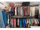 A walk-in closet has two rods for hanging clothes as well as a wire shelf above for luggage at 1637 Bent Oaks Blvd, Deland, FL 32724
