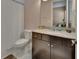 Bathroom featuring granite countertop, sleek vanity, and tiled floors at 171 Birchmont Dr, Deland, FL 32724