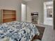 Bedroom featuring a bed, shelving, and television at 171 Birchmont Dr, Deland, FL 32724