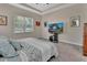 Comfortable bedroom featuring a window, carpeted floors, and a TV at 171 Birchmont Dr, Deland, FL 32724