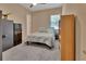 This bedroom features neutral tones and a ceiling fan at 171 Birchmont Dr, Deland, FL 32724