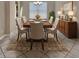 Traditional dining room with wood table, upholstered chairs, buffet, and decorative rug at 171 Birchmont Dr, Deland, FL 32724