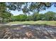 Scenic view of the golf course surrounded by mature trees and lush greenery at 171 Birchmont Dr, Deland, FL 32724