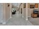 Hallway featuring tiled flooring, neutral walls, and decorative accents at 171 Birchmont Dr, Deland, FL 32724