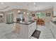 Spacious kitchen with a large island, granite countertops, stainless steel appliances, and open to breakfast nook at 171 Birchmont Dr, Deland, FL 32724