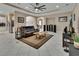 Open-concept living room with neutral walls, tile floors, recessed lights, and a view of the kitchen at 171 Birchmont Dr, Deland, FL 32724