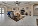 Inviting living area with modern lighting, neutral colors, tile floor, and plenty of space at 171 Birchmont Dr, Deland, FL 32724