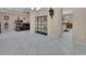 Open-concept living room with tile flooring, chandelier, display shelf, and adjacent dining area at 171 Birchmont Dr, Deland, FL 32724