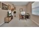 Spacious home office features a glass desk and modern decor, perfect for productivity at 171 Birchmont Dr, Deland, FL 32724