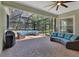 Inviting screened-in patio with comfortable seating, ideal for outdoor relaxation and entertainment at 171 Birchmont Dr, Deland, FL 32724