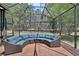 Enclosed patio with cozy seating, perfect for enjoying the outdoor scenery and natural light at 171 Birchmont Dr, Deland, FL 32724