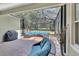 Relaxing screened patio with comfortable seating, grill and view of golf course at 171 Birchmont Dr, Deland, FL 32724