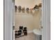 Functional walk-in closet with shelving for shoes and hats at 171 Birchmont Dr, Deland, FL 32724
