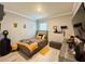 Stylized bedroom featuring neutral decor, unique wall art and a large window to provide an abundance of natural light at 1759 Copinger Ter, Kissimmee, FL 34744