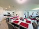 Open-concept dining and kitchen area features a large island, dining table and living room for easy living at 1759 Copinger Ter, Kissimmee, FL 34744