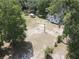 A high angle shows a detached building on a large lot near a white home at 1880 N Sparkman Ave, Orange City, FL 32763