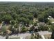 Expansive wooded acreage featuring a home, outbuildings, and ample road frontage at 1880 N Sparkman Ave, Orange City, FL 32763