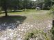 The backyard is spacious, with grass and features a detached structure at 1880 N Sparkman Ave, Orange City, FL 32763