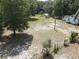An aerial view shows a detached building on a large lot near a home at 1880 N Sparkman Ave, Orange City, FL 32763