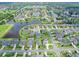 Stunning aerial view of a well-planned community featuring lakes, lush landscaping, and sidewalks at 1923 Mendocino Ln, Port Orange, FL 32128