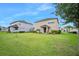 Large backyard, great for outdoor activities and relaxation, surrounded by lush green grass at 1923 Mendocino Ln, Port Orange, FL 32128