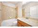 Bathroom with a vanity, a bathtub with tiled walls, and a sink at 1923 Mendocino Ln, Port Orange, FL 32128