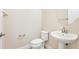 Powder room featuring a pedestal sink, tile floors, and modern fixtures at 1923 Mendocino Ln, Port Orange, FL 32128