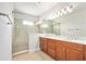 This bathroom features a double sink vanity and walk-in glass shower at 1923 Mendocino Ln, Port Orange, FL 32128