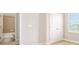 Bedroom with a nearby bathroom and closet featuring lots of natural light at 1923 Mendocino Ln, Port Orange, FL 32128