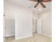 This bedroom features neutral walls, carpeted floors, and walk in closet at 1923 Mendocino Ln, Port Orange, FL 32128
