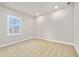 A vacant bedroom with neutral carpeting and a window at 1923 Mendocino Ln, Port Orange, FL 32128